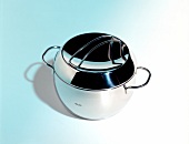 Stainless steel pot on blue background