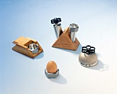 Salt shaker, pepper mill and various other kitchen items on white background