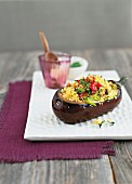 An aubergine filled with couscous and vegetables