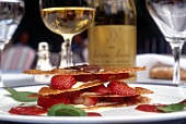 Close-up of feuillantines of strawberries and cream with rosemary honey