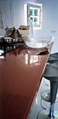 Kitchen with glossy working surface of crystallite