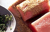 Close-up of raw white tuna with spices and albacore salad