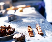 Pieces of roasted veal tail on table for preparation