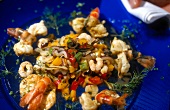 Close-up of seafood salad on blue plate