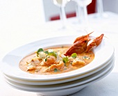 Pike, perch and crayfish soup on plate