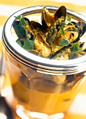 Close-up of bouchot mussels with saffron and fennel curry in glass