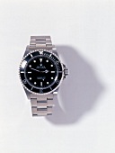 Submariner wrist watch on white background