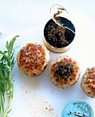 Veal cutlets with can of caviar and herbs on white background