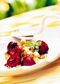 Fried couscous with cherry ragout and yogurt