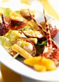 Close-up of lobster with mango-lime salad on plate