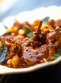 Close-up of braised rabbit with sherry and cardamom
