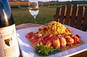 Close-up of lobster with corn in serving dish