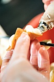 Close-up of woman's hand making chocolate in Belgium