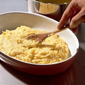 Close-up of polenta being cooked in frying pan