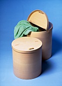 Beech wooded laundry baskets made of blue background