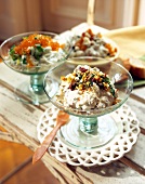 Three varieties of mascarpone cream in glass bowls