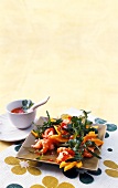 Arugula salad with mango, shrimp and onions on plate
