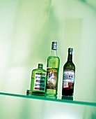 Absinthe bottles on glass slab