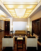 Designer lounge of Dylan Hotel in yellow light, New York, United States