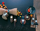 Various luxury watches on wood