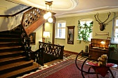 Room with wooden staircase in hotel, Germany
