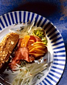 Roast beef and papaya baguette with fennel and Brazil nuts on plate