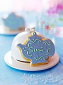 A homemade place card biscuits shaped like a teapot