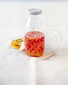 Sweet and sour chili sauce in glass bottle