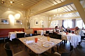 Guests sitting at table in restaurant, Austria