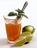 Mango and papaya juice with lime on white background