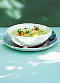 Langoustines with peas and saffron puree in bowl