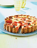 Tomato and goat's cheese tart served on plate