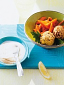 Chickpea balls with carrots in bowl
