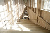 View of staircase with people and sunlight, Germany