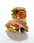 Two pieces of sandwiches with chicken breast, oysters and caviar
