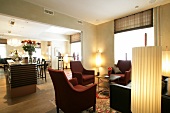 Interior of room with sofa, lamp and bar counter in hotel, Switzerland