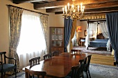 Interior of hotel with wooden dining table, chairs and curtains, Czech Republic