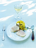 Turbot fillet with mashed potatoes and thyme leaves served on plate