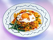 Jakarta fried rice with fried egg on plate