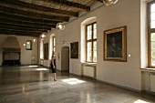 Woman standing in hall, Germany