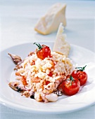 Close-up of tomato risotto with calamari on plate