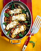 Baked peppers with tomatoes, eggplant and cheese in pan