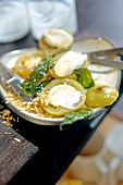 Green tomatoes with gorgonzola cream on plate