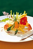 Langoustines with tempura, mashed potatoes and vegetables on serving plate
