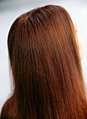 Rear view of red haired woman with long hair, close-up