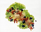 Close-up of spicy salad with mozzarella and black olives