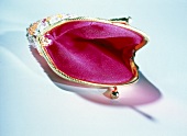 Close-up of pink open purse