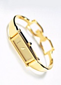 Close-up of golden wrist watch on white background