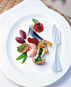 Mackerel and lobster with beetroot puree and ginger on plate