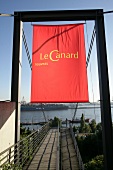 Red signboard of Le Canard Nouveau, Germany